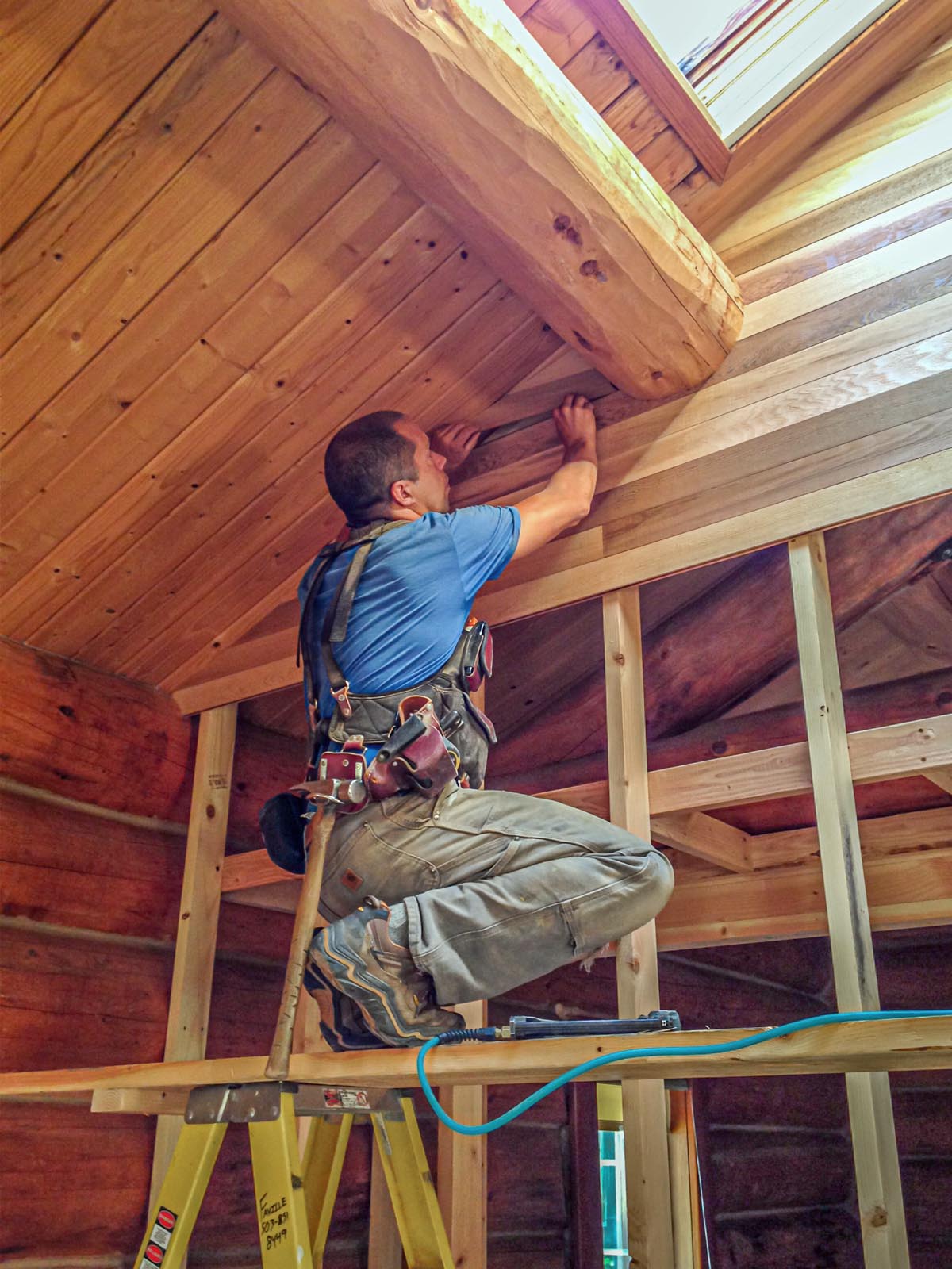 jon working on a cabin interior