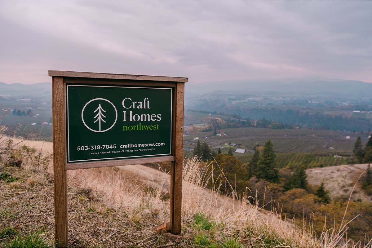 Craft Homes sign with view of the valley in the background